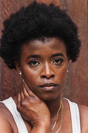 Sad Black woman with Afro hairstyle looking at camera
