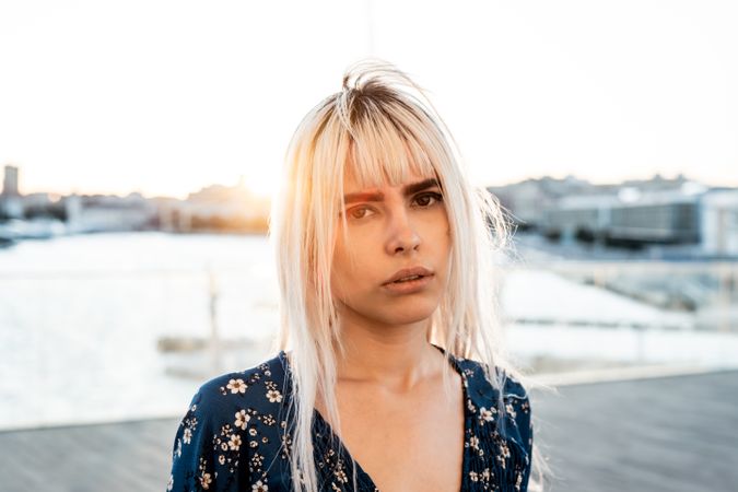 Woman looking at camera during sunrise