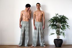 Stylish shirtless gay couple posing