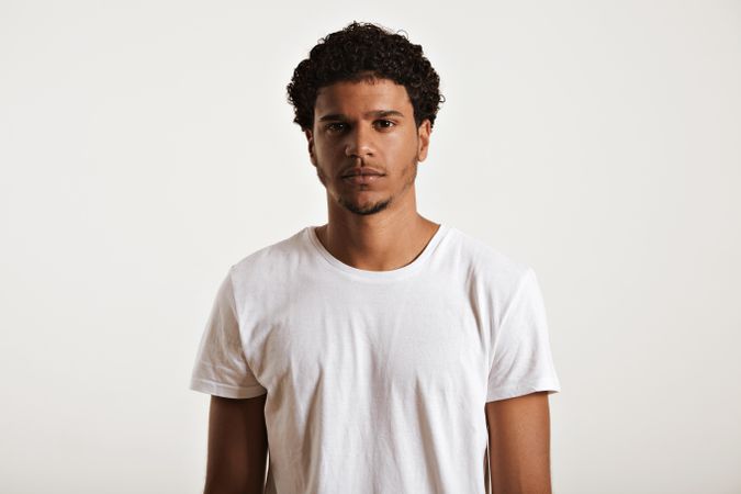 Portrait of Black man with neutral expression in studio shoot