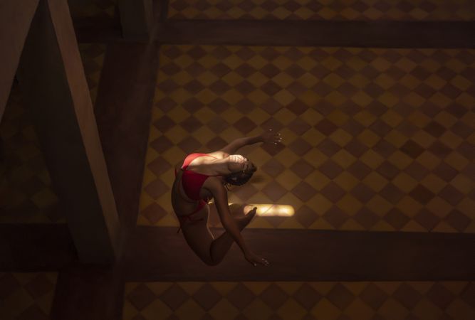 Woman dancing in dark church