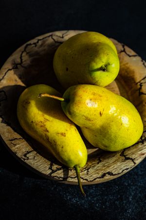Close up of pears on rustic plate