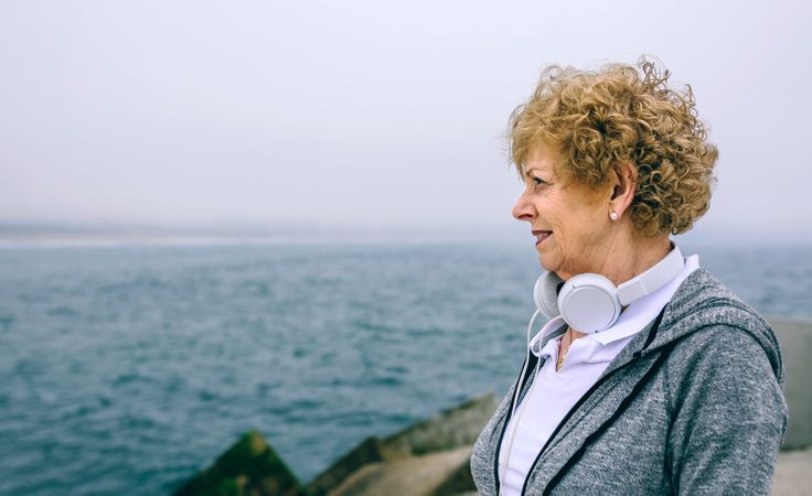 Mature sportswoman looking at the sea