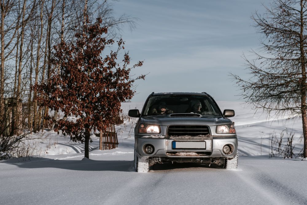 Car driving on snow field