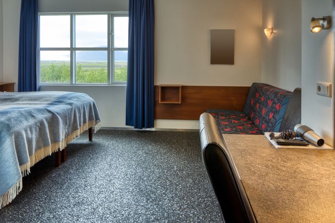 Comfortable hotel room with rural view from window