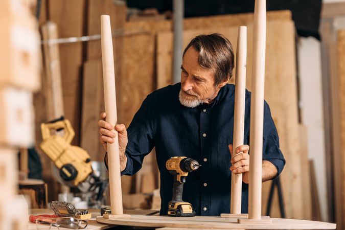 Male carpenter working on furniture