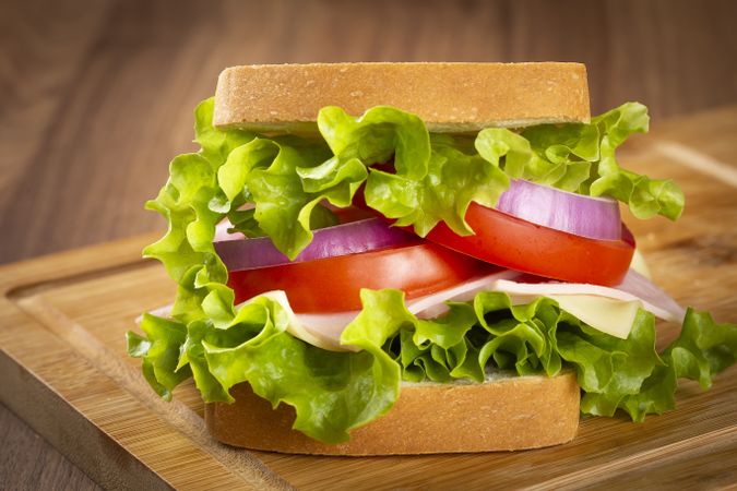 Natural sandwich. Sandwich with cheese, ham, lettuce, tomato and red onion.