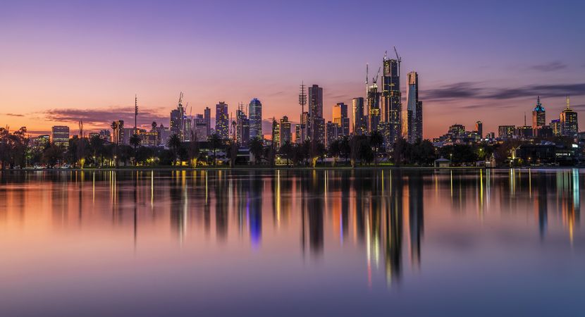 City skyline of Melbourne, Australia across the sea at sunset