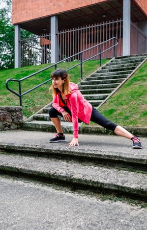 Female athlete doing stretching outdoors