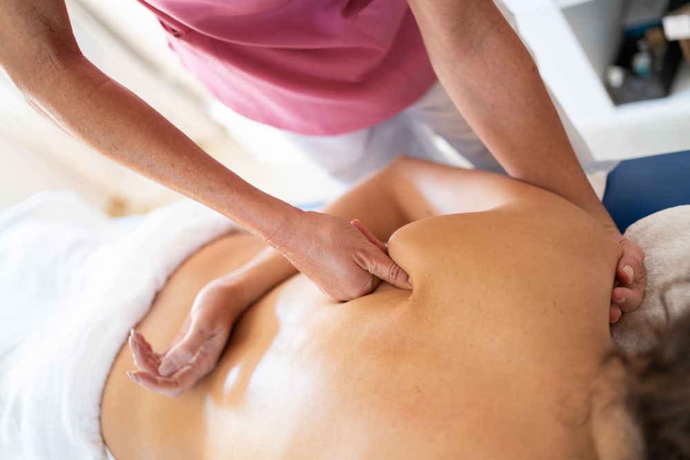 Close up of woman's back receiving massage