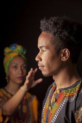 Woman pulling hand to face of man