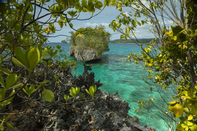 Photograph of the natural seascape of turquoise waters surrounding the Togian Islands, Indonesia