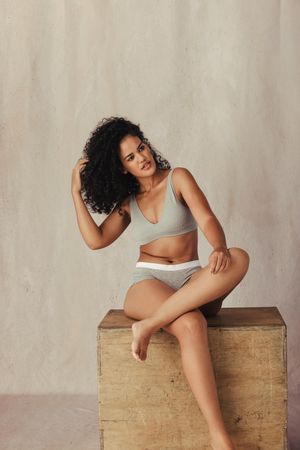 Curly haired model feeling confident in her natural body