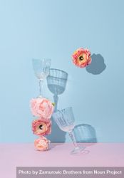 Wine glasses and flowers against a baby blue and pink background 0PONgb
