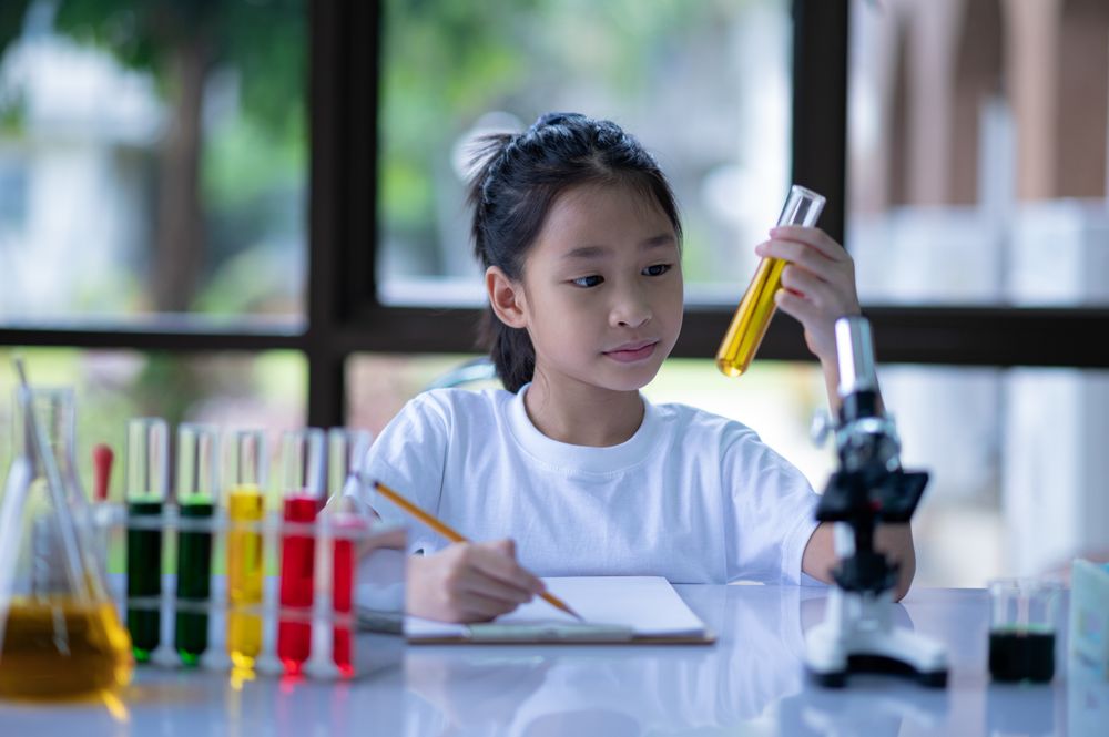 A girl doing a science experiment.