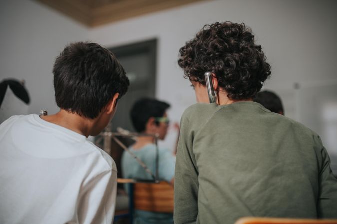 Two boys talking during band practice