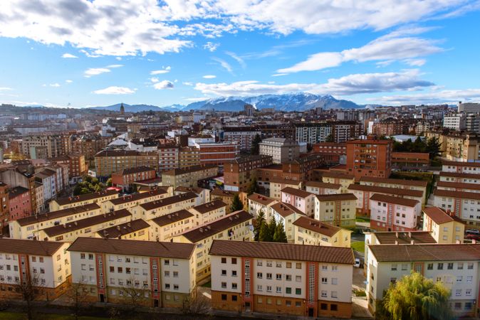 Modern buildings in city near mountains