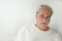 Portrait of disappointed middle aged man in light shirt