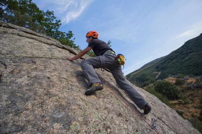 Man climbing a rock
