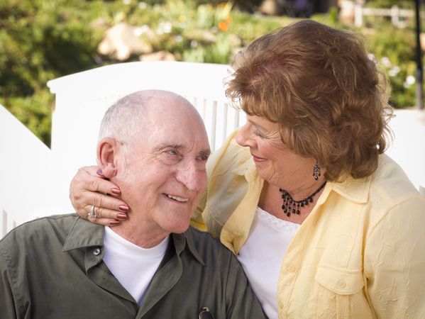 Mature Couple Kissing in the Park