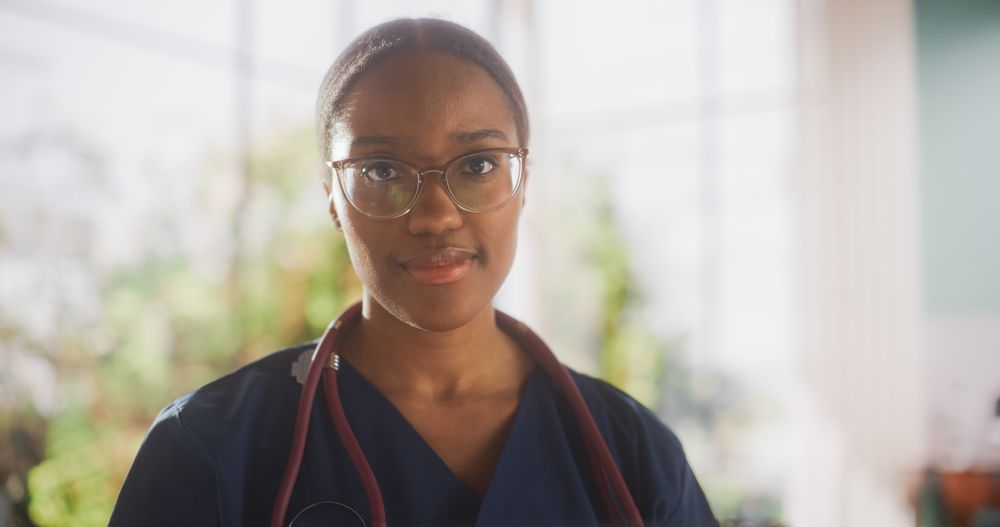 Portrait of a Black Female Medical Health Care Professional Posing for Camera, Smiling and Looking at Camera