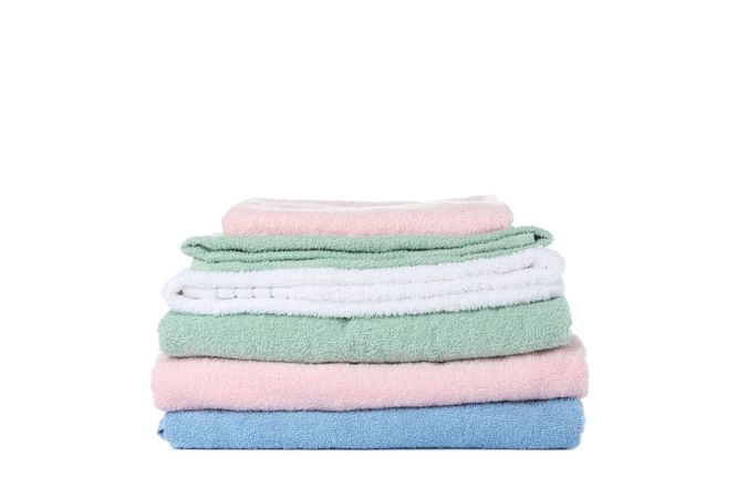 Folded color towels isolated on blank background