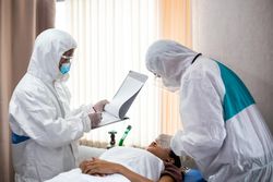 Emergency doctor with patient and nurse