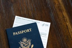 Cropped shot of US passport and CDC vaccination card