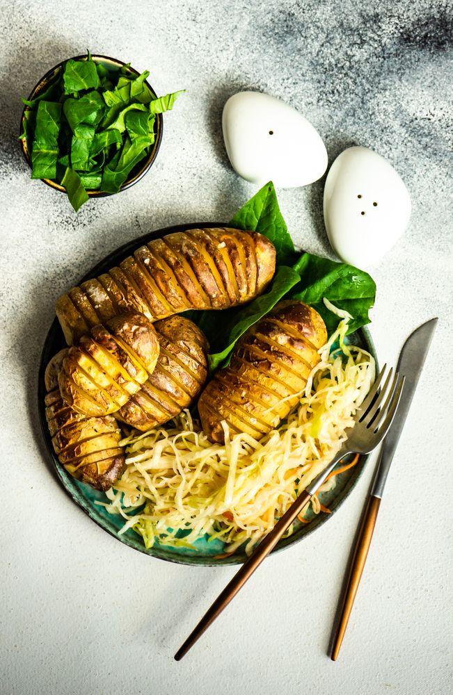 Plate of potato fans with coleslaw & spinach