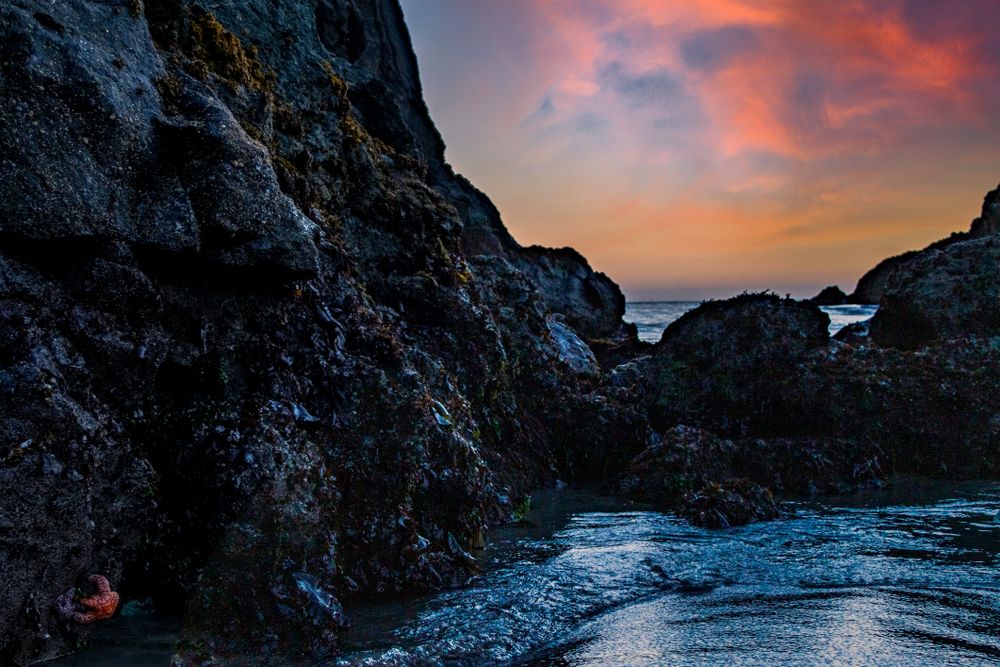 Rocky coast under clouds at the Pacific Ocean