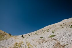Landscape with hill and moon in blue sky