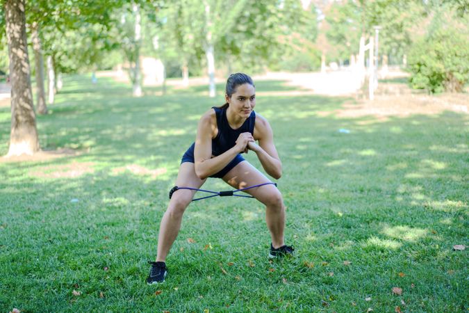 Woman working out legs in park