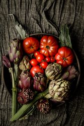 Assorted vegetables and napkins on table