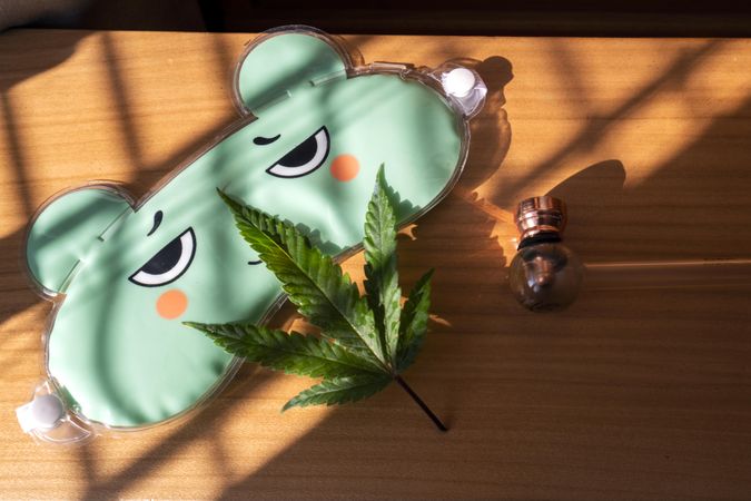 Cartoon eye mask with marijuana plant