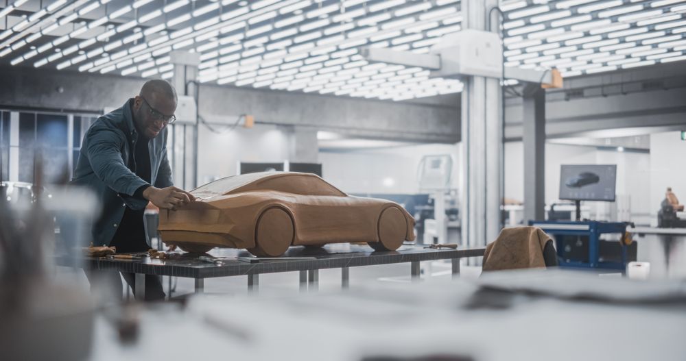Black Modeler Working in a Research and Development Studio at a Vehicle Production Factory