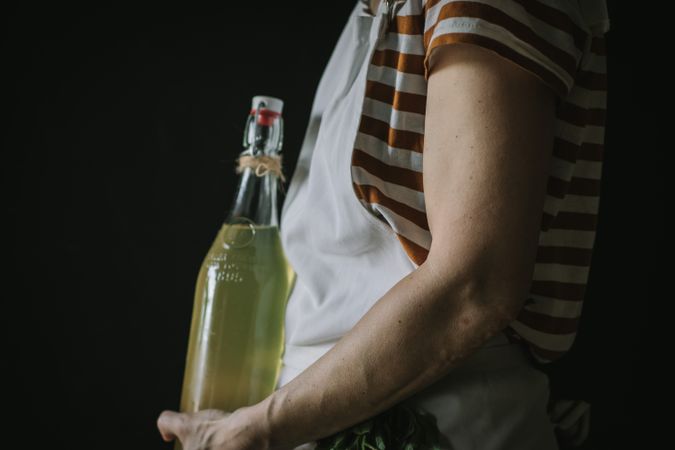Female with bottle of elderflower syrup
