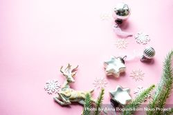 Star and reindeer Christmas ornaments on pink background 0LxMA0