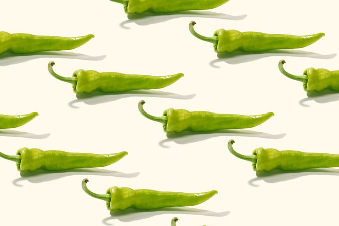 Rows of whole green peppers