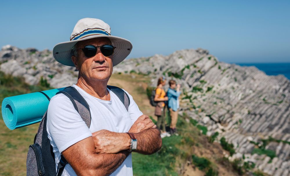 Man in foreground of his hiking crew enjoying view