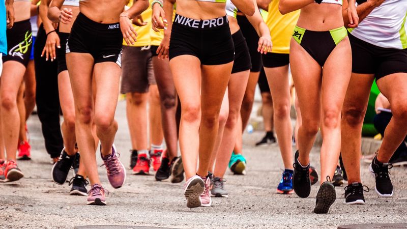 Cropped image of people running in the marathon