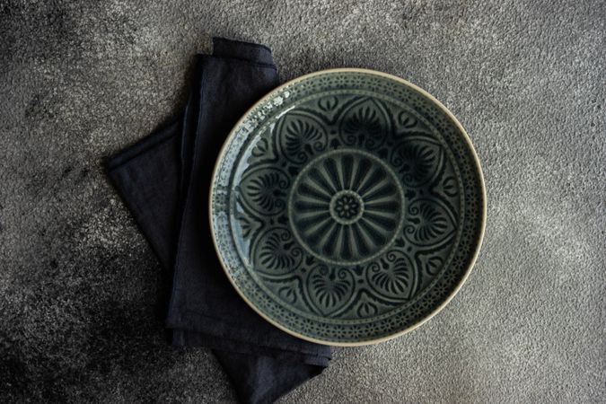 Top view of table setting with elegant patterned plate