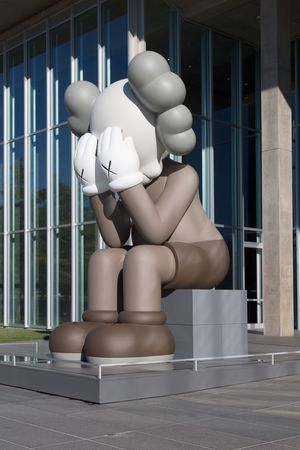 The sculpture "Companion (Passing Through)," by KAWS, at the Modern Art Museum of Fort Worth, Texas