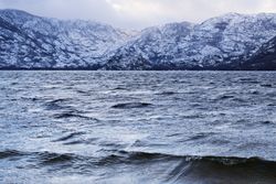 Shore with mountains near water