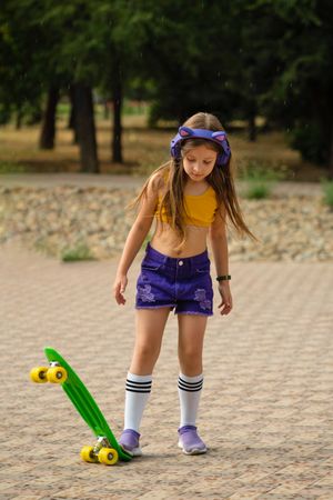 Female Child On Skateboard