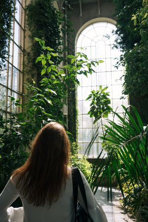 Woman walking in greenhouse