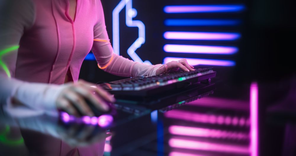 Close Up of a Young Female Playing Online Video Games on a Desktop Computer.