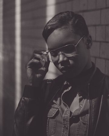 Monochrome image of woman in glasses