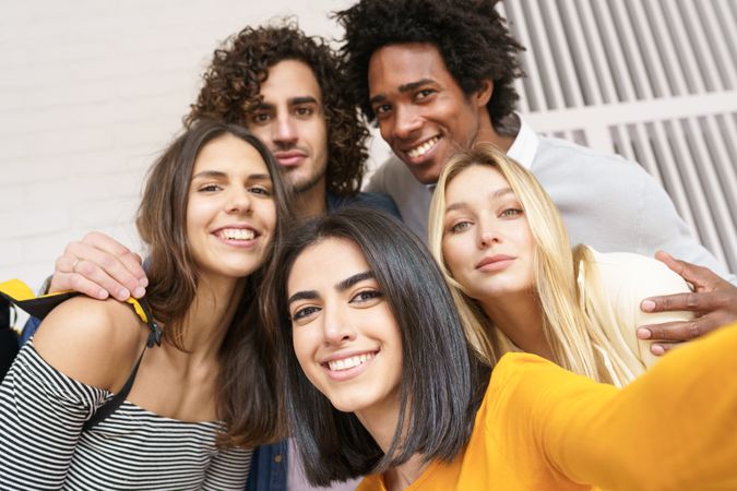 Friends having fun taking a picture outside