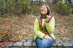 Mature woman enjoying spliff outside