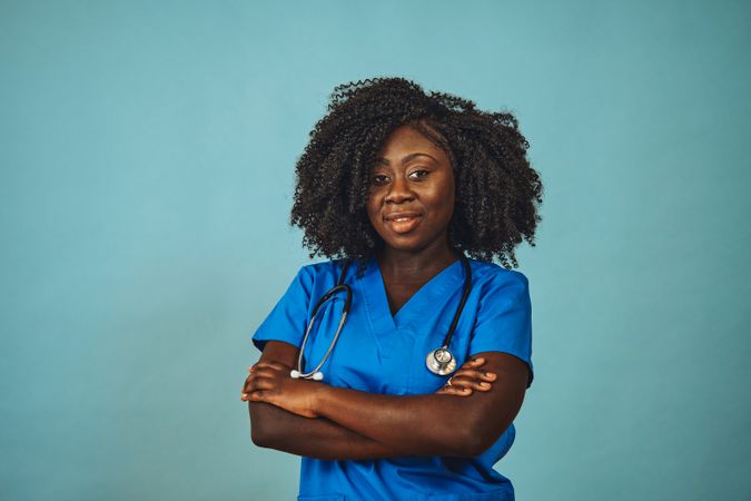 Portrait of confident Black medical professional dressed in scrubs